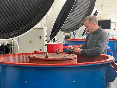 Member of staff standing by a machine