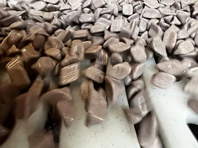 Product Finishing bedurring and polishign media in a machine close up