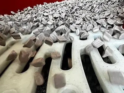 Surface Finishing Subcontract Media in a vibratory finishing machine