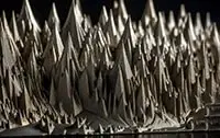 depiction of a metallic range of mountains representing the surface of metal through a microscope